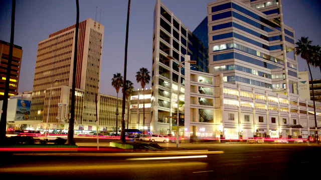 Commercial buildings and evening activity in central Harare.