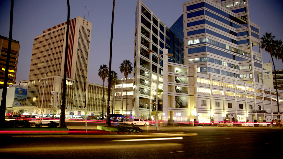Commercial buildings and evening activity in central Harare.