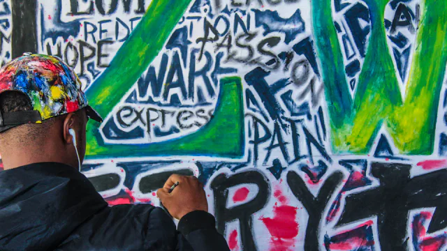 A young Zimbabwean creative working on a community art project in Harare.